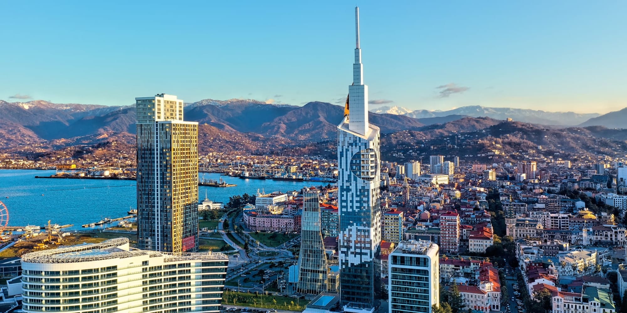 Modern city skyline with digital tokens overlay representing global access to real estate investments through blockchain technology