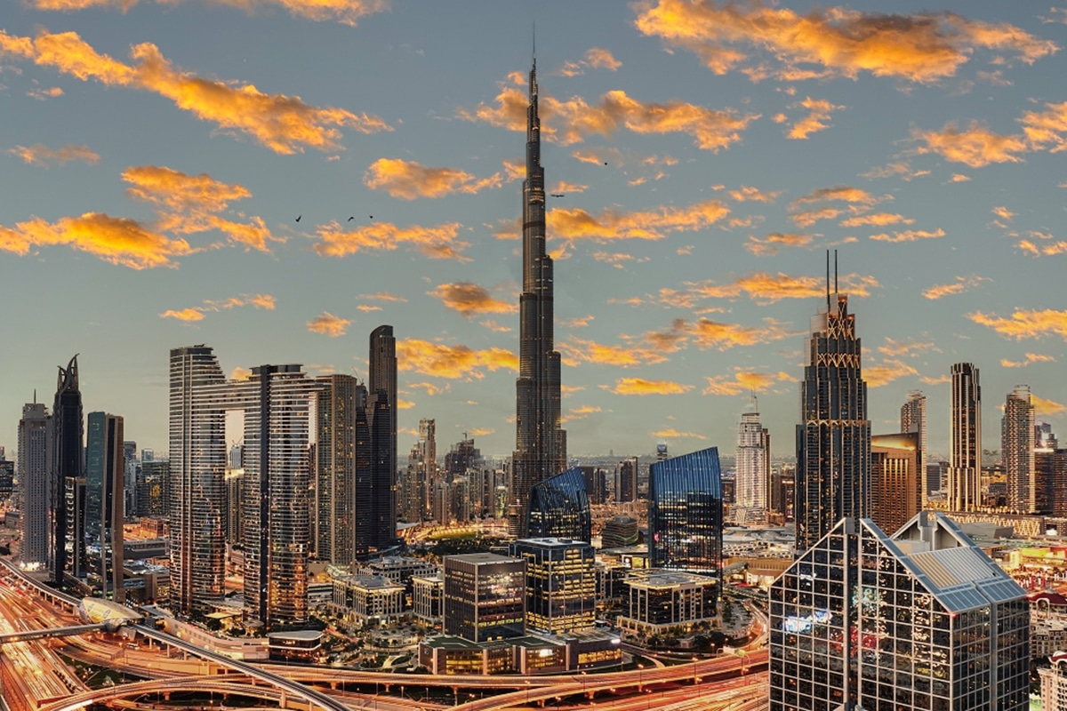Aerial view of Dubai skyline with futuristic blockchain overlay representing real estate tokenization and fractional ownership in UAE 2026